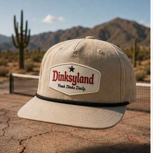 Court 01 · Biscuit — Dinksyland Richardson 256 rope cap shot on a desert pickleball court