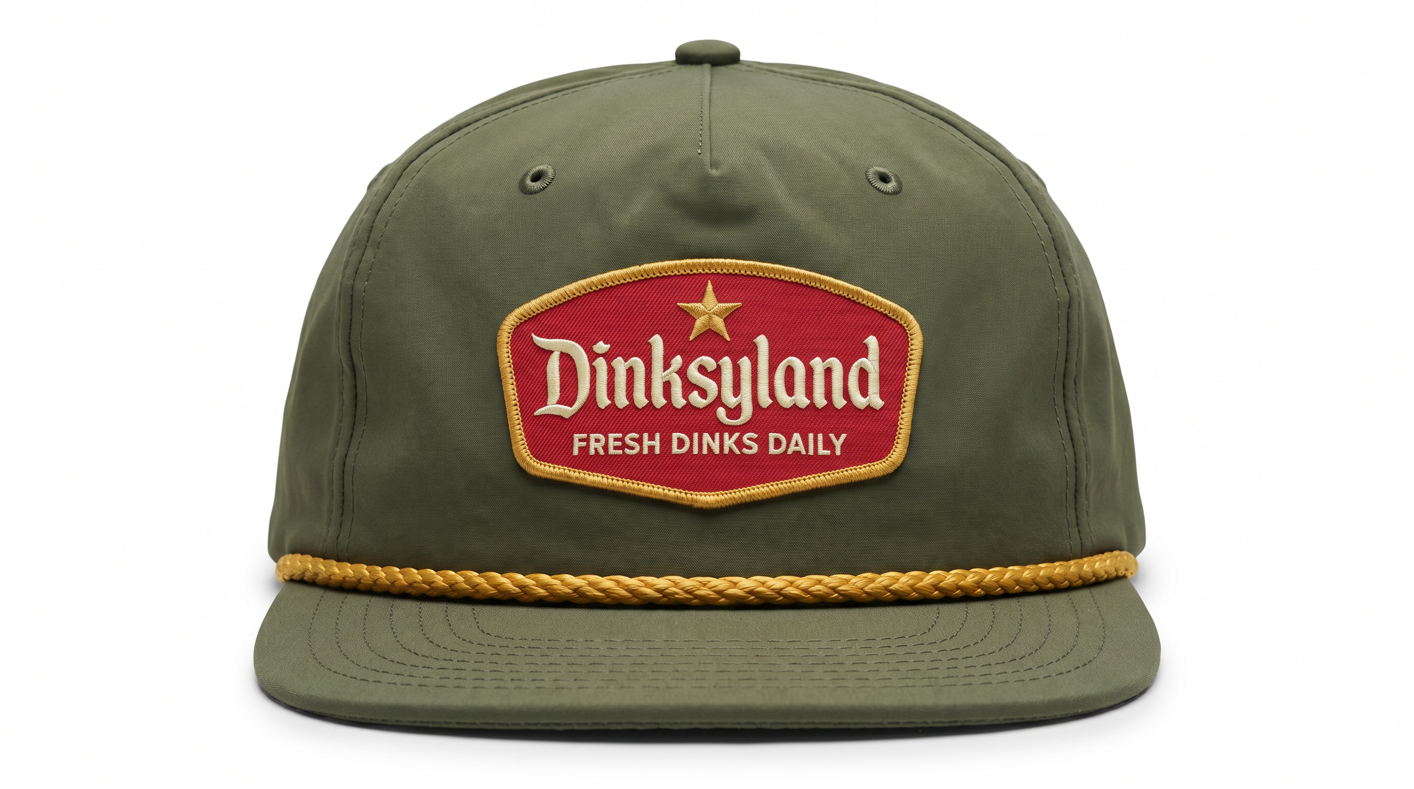 The Classic — Loden Richardson 256 rope cap with amber gold rope and a red embroidered Dinksyland patch with a gold border.