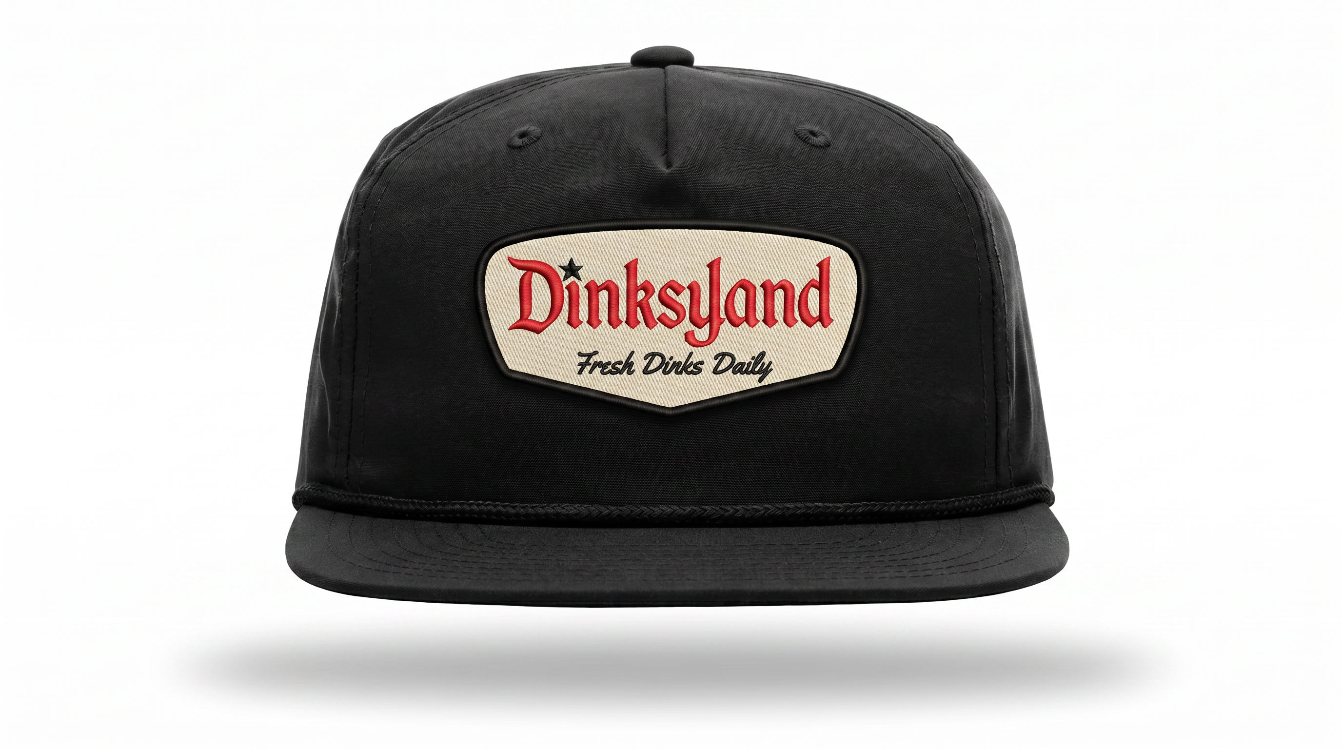 Heritage — Black Richardson 256 rope cap with black rope and a cream embroidered Dinksyland patch with a black border.